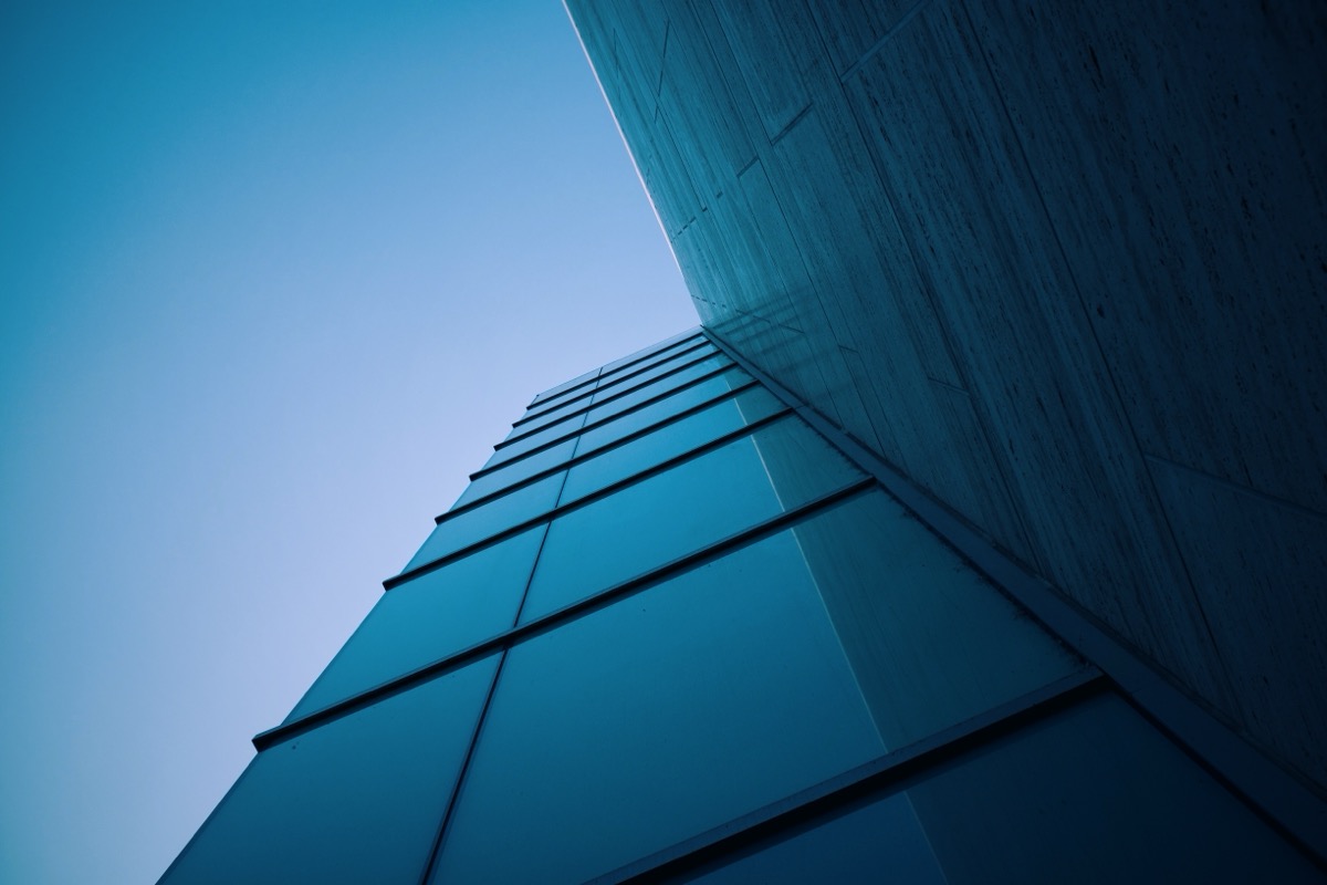 Looking up at a modern glass office building